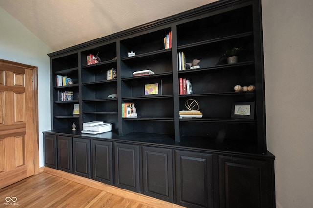 details featuring wood finished floors and baseboards