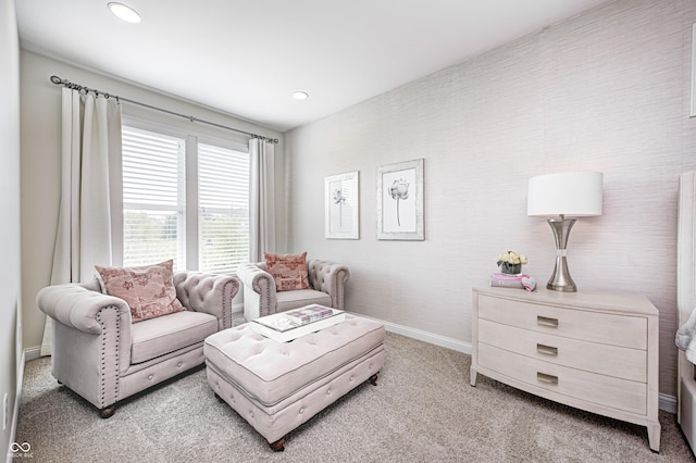 interior space featuring baseboards, recessed lighting, and light carpet
