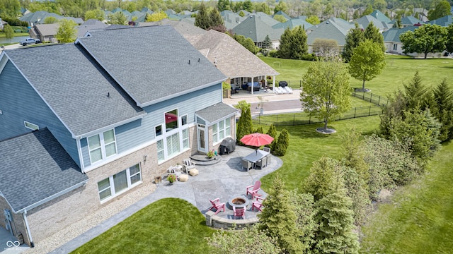 birds eye view of property with a residential view