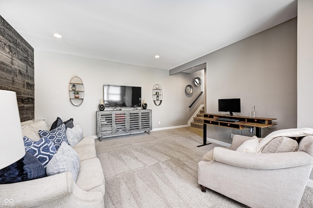 carpeted living room with stairway, baseboards, and recessed lighting