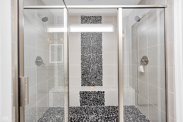 full bath featuring a shower stall
