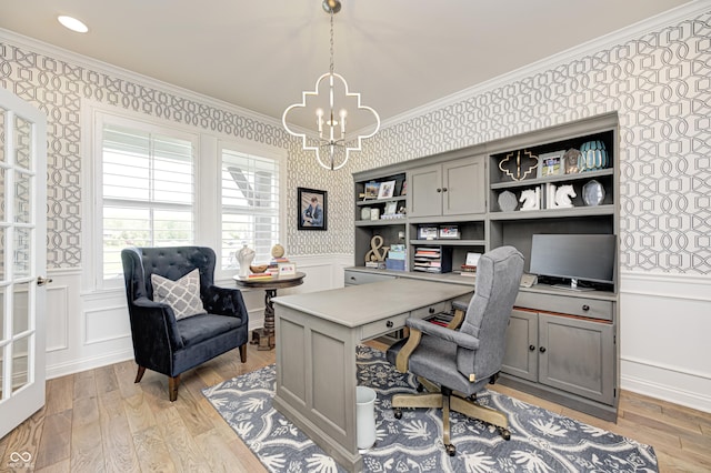 office with crown molding, light wood-type flooring, a chandelier, and wallpapered walls