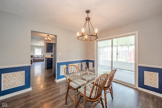 dining space with baseboards, an inviting chandelier, wainscoting, and dark wood-type flooring