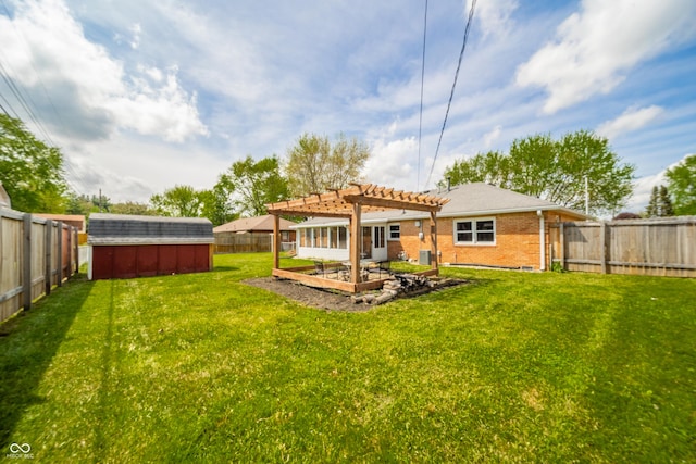 view of yard featuring a storage unit, a fenced backyard, a pergola, and an outdoor structure
