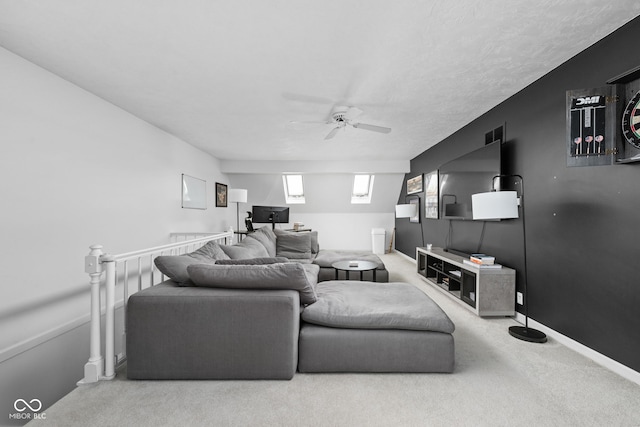 living room featuring ceiling fan and carpet