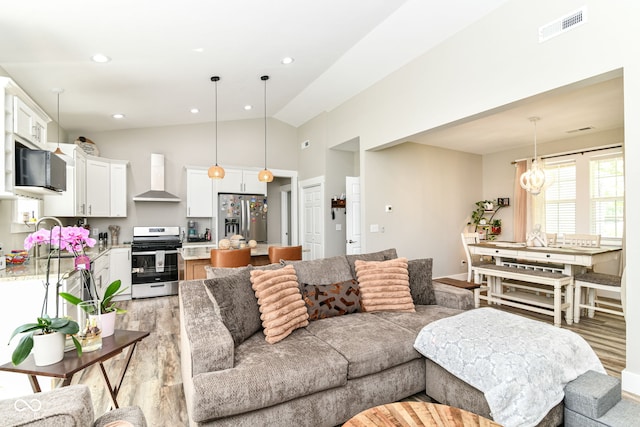 6301 Prospect St, Indianapolis, IN 46203 - living area with light wood-type flooring, recessed lighting, and high vaulted ceiling