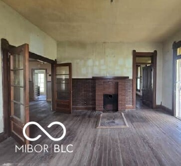 living room featuring wood finished floors and a fireplace