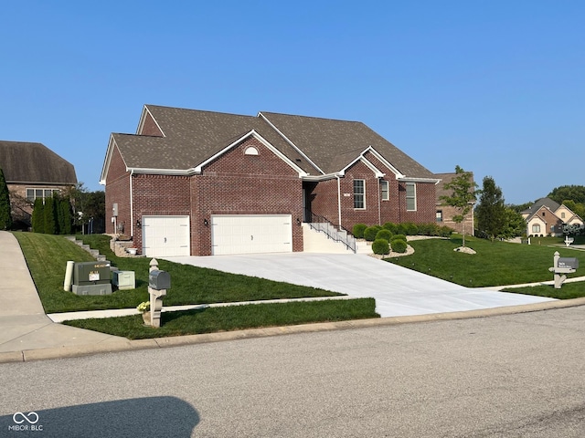 view of front of property with brick siding, a front yard, and concrete driveway