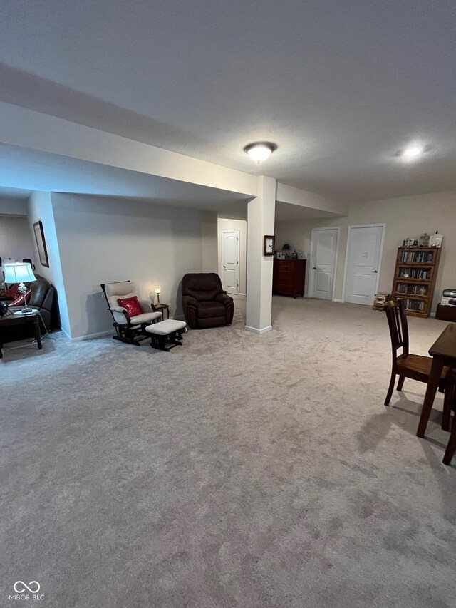 sitting room with carpet floors and baseboards