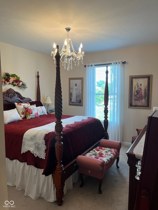 bedroom with carpet and a notable chandelier
