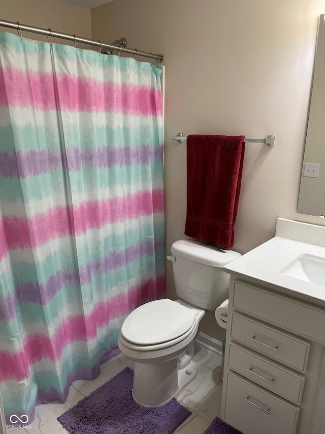 bathroom with vanity, a shower with curtain, toilet, and marble finish floor