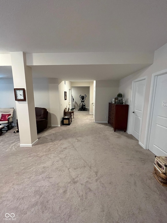 finished below grade area with baseboards and carpet