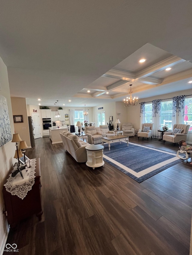 living area with an inviting chandelier, recessed lighting, coffered ceiling, and dark wood-type flooring