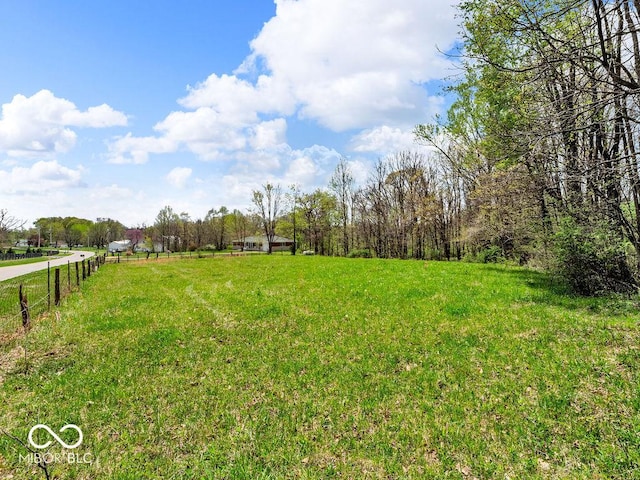 view of yard with a rural view
