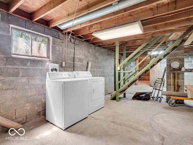 below grade area with stairway and separate washer and dryer