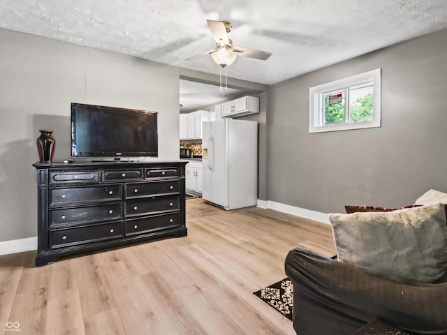1401 E 24th St, Muncie, IN 47302 - sitting room with a ceiling fan and light wood-type flooring
