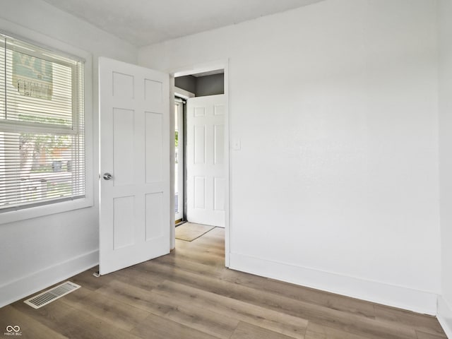 1401 E 24th St, Muncie, IN 47302 - unfurnished bedroom featuring baseboards and wood finished floors
