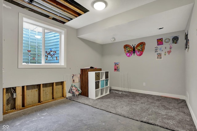 game room with baseboards and concrete floors
