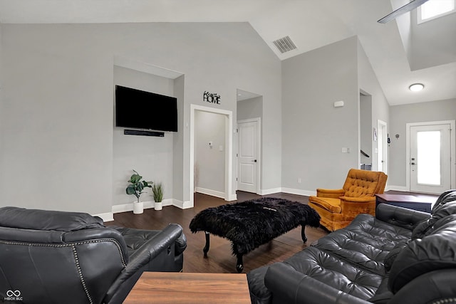 living room featuring visible vents, dark wood finished floors, stairway, baseboards, and high vaulted ceiling