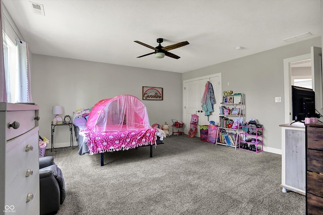 bedroom with carpet, a ceiling fan, baseboards, visible vents, and a closet