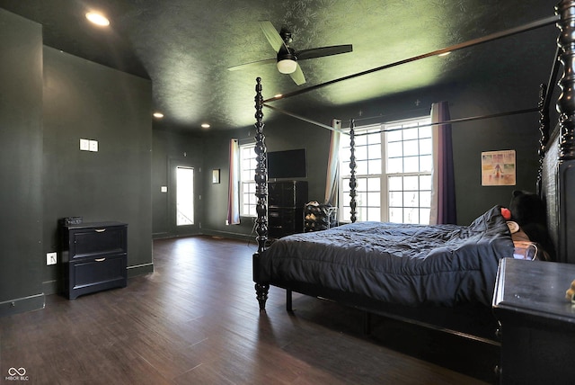 bedroom with recessed lighting, baseboards, and wood finished floors