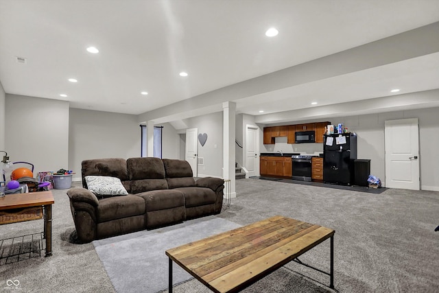 living area featuring light carpet, stairs, recessed lighting, baseboards, and visible vents