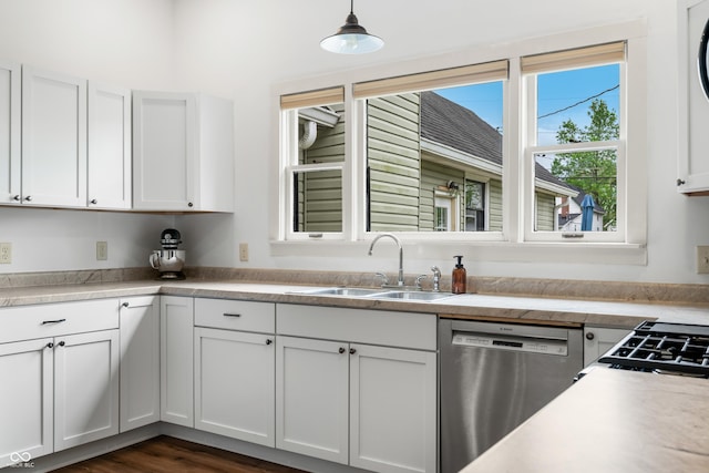 kitchen featuring a sink, light countertops, stainless steel dishwasher, and white cabinetry