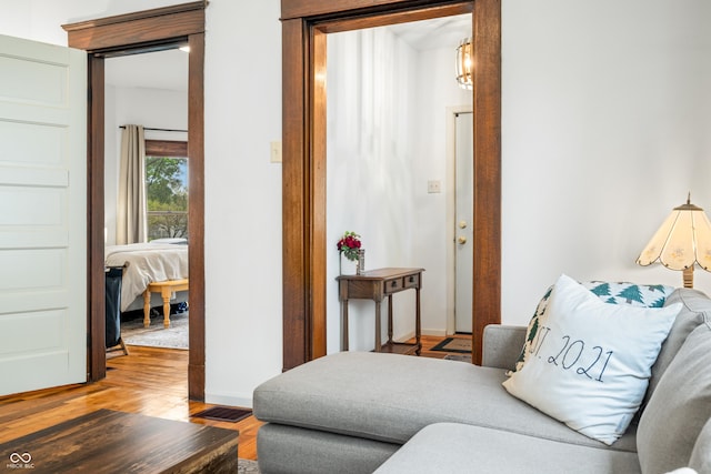 living room featuring baseboards and light wood-type flooring