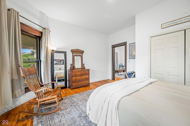 bedroom featuring a closet and wood finished floors