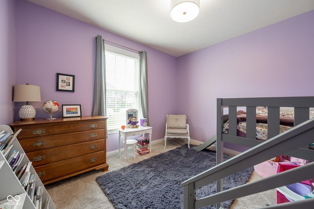 bedroom featuring baseboards and carpet flooring