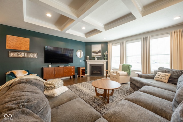 living room with crown molding, wood finished floors, beamed ceiling, a fireplace with flush hearth, and coffered ceiling