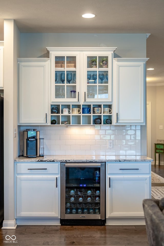 bar with tasteful backsplash, dark wood-style flooring, recessed lighting, and beverage cooler