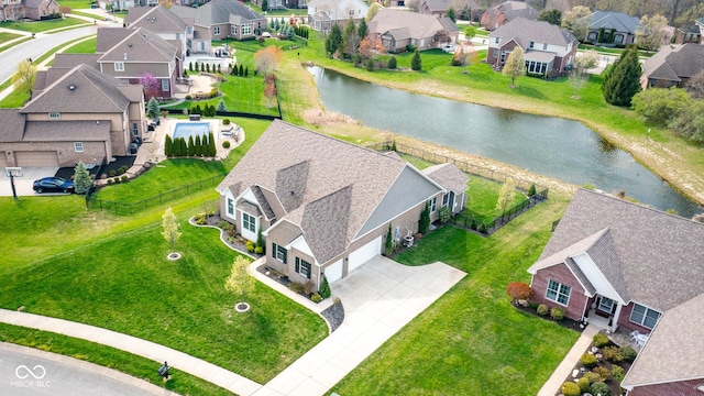 bird's eye view with a water view and a residential view