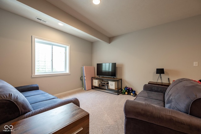 living area featuring recessed lighting, baseboards, visible vents, and light carpet