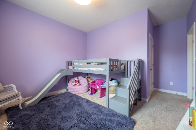 bedroom with baseboards and carpet flooring