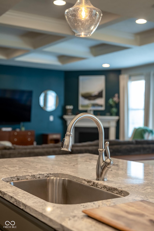 interior details featuring recessed lighting, a sink, and coffered ceiling