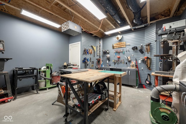 interior space with a workshop area and concrete floors