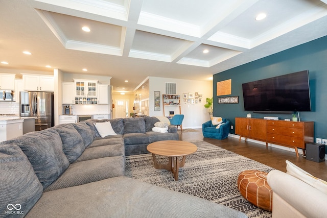 living area featuring visible vents, crown molding, wood finished floors, beamed ceiling, and coffered ceiling
