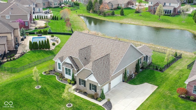 bird's eye view with a residential view and a water view