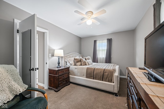 bedroom featuring baseboards, light carpet, and a ceiling fan