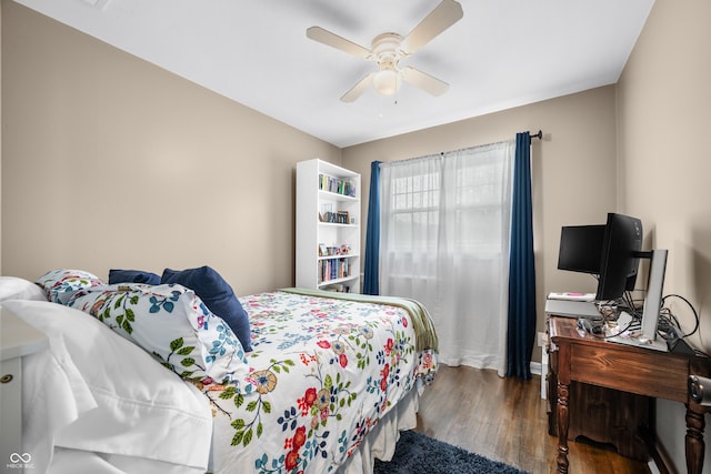 bedroom featuring ceiling fan and wood finished floors