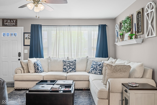 living room featuring ceiling fan, a healthy amount of sunlight, and wood finished floors