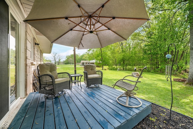 wooden terrace with a lawn