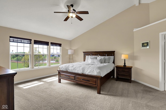 carpeted bedroom with baseboards, high vaulted ceiling, and a ceiling fan
