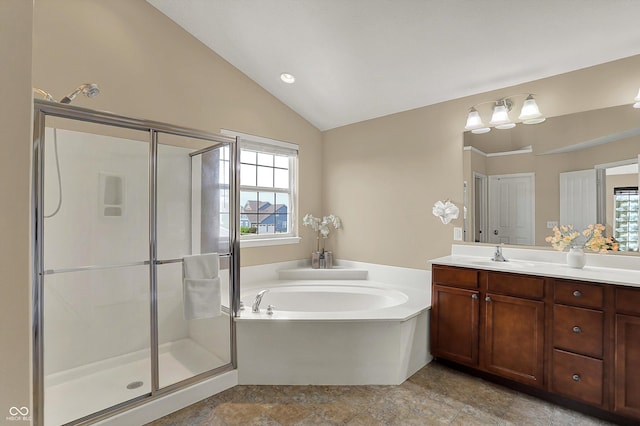 full bath with a stall shower, a garden tub, vanity, and lofted ceiling