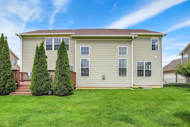 rear view of house featuring a deck