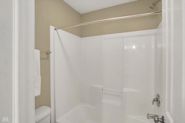 full bathroom with toilet and tub / shower combination