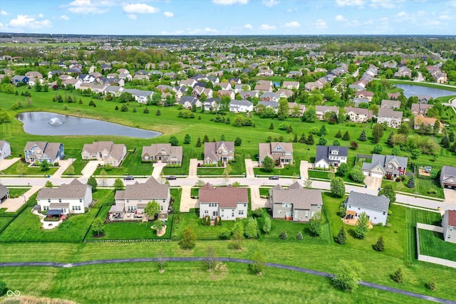 aerial perspective of suburban area with a large body of water