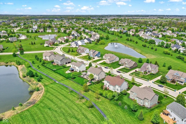 aerial perspective of suburban area with a large body of water
