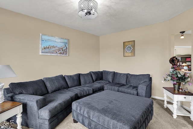 carpeted living area with baseboards